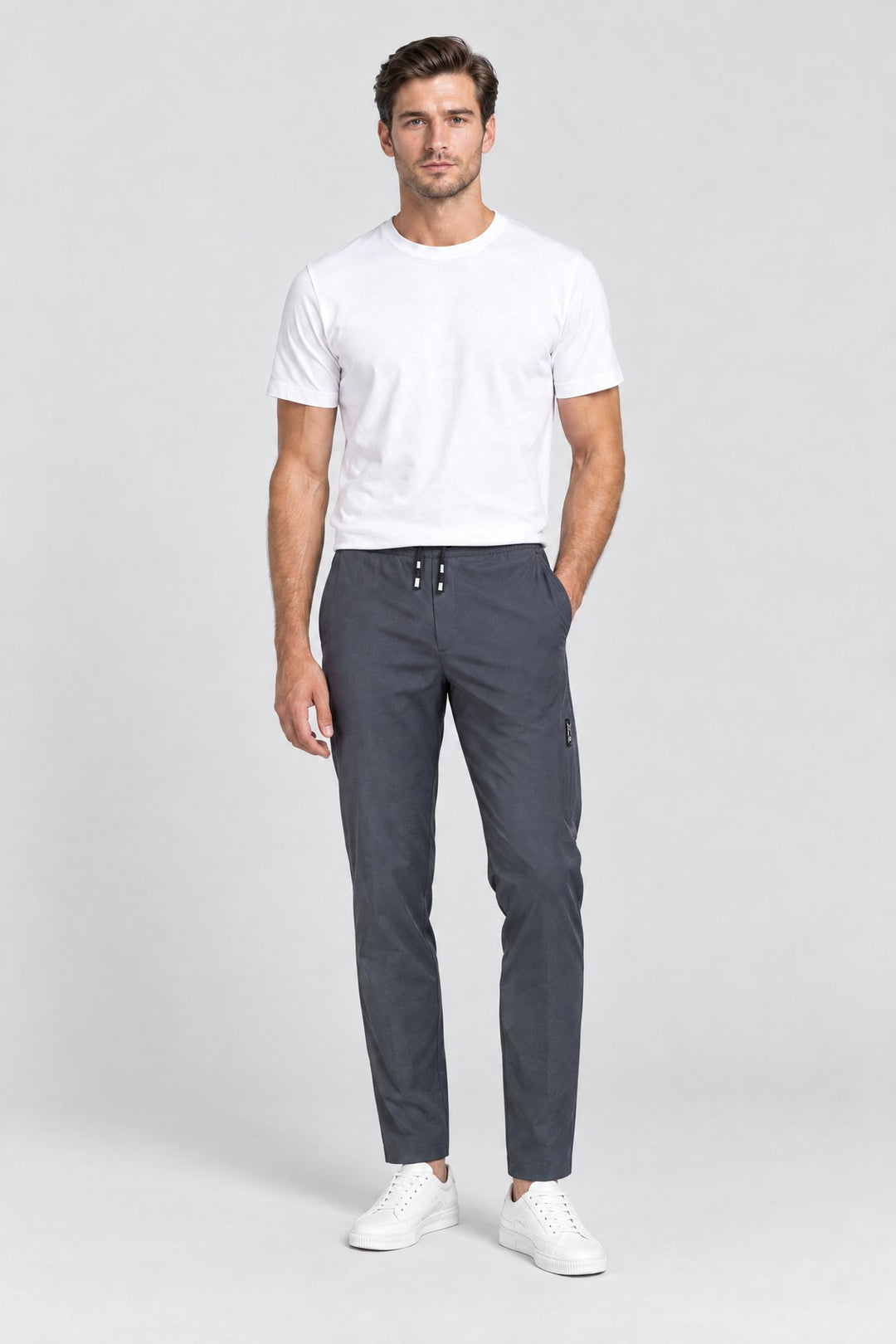 The Camden Tech Trouser in Charcoal worn by model