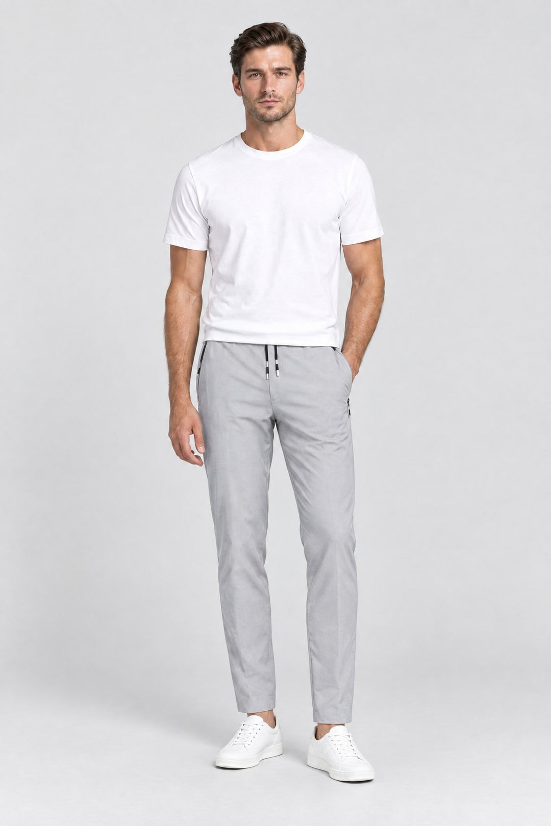 The Camden Tech Trouser in Light Grey worn by model
