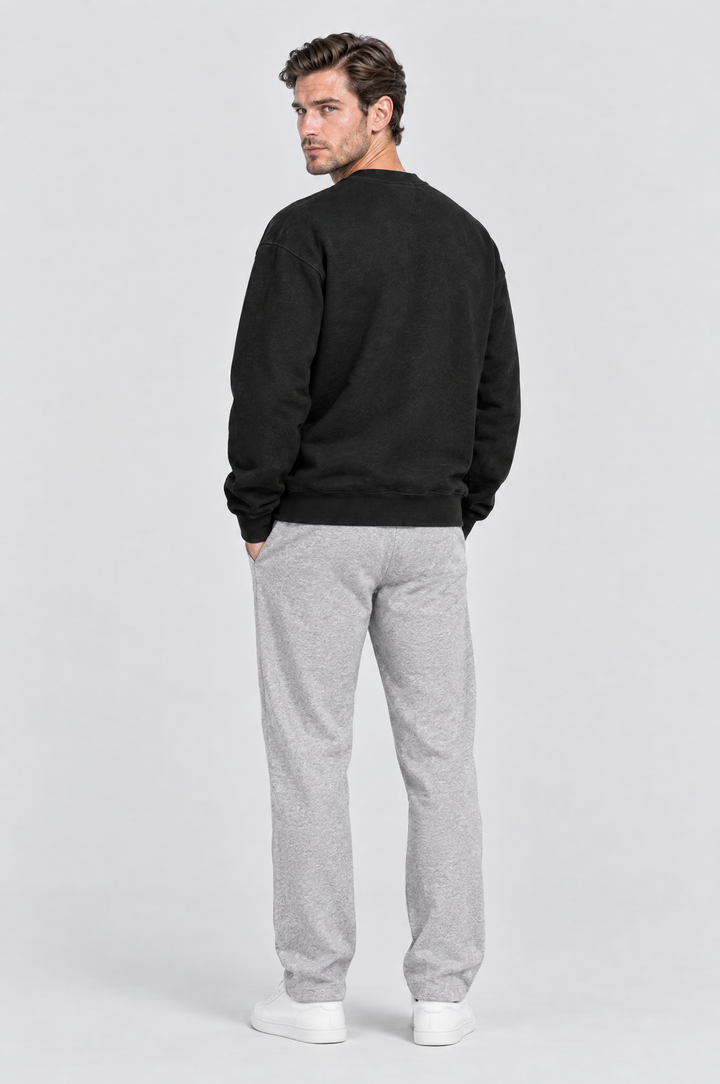 The Hackney Crewneck Sweatshirt in Black, on model, back view