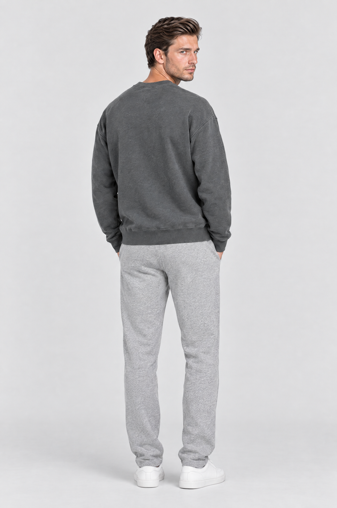 The Hackney Crewneck Sweatshirt in Charcoal, on model, back view