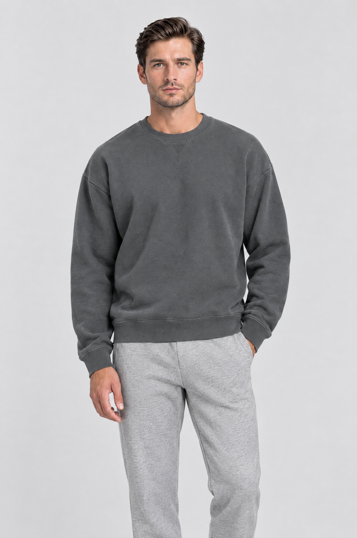 The Hackney Crewneck Sweatshirt in Charcoal, on model, front