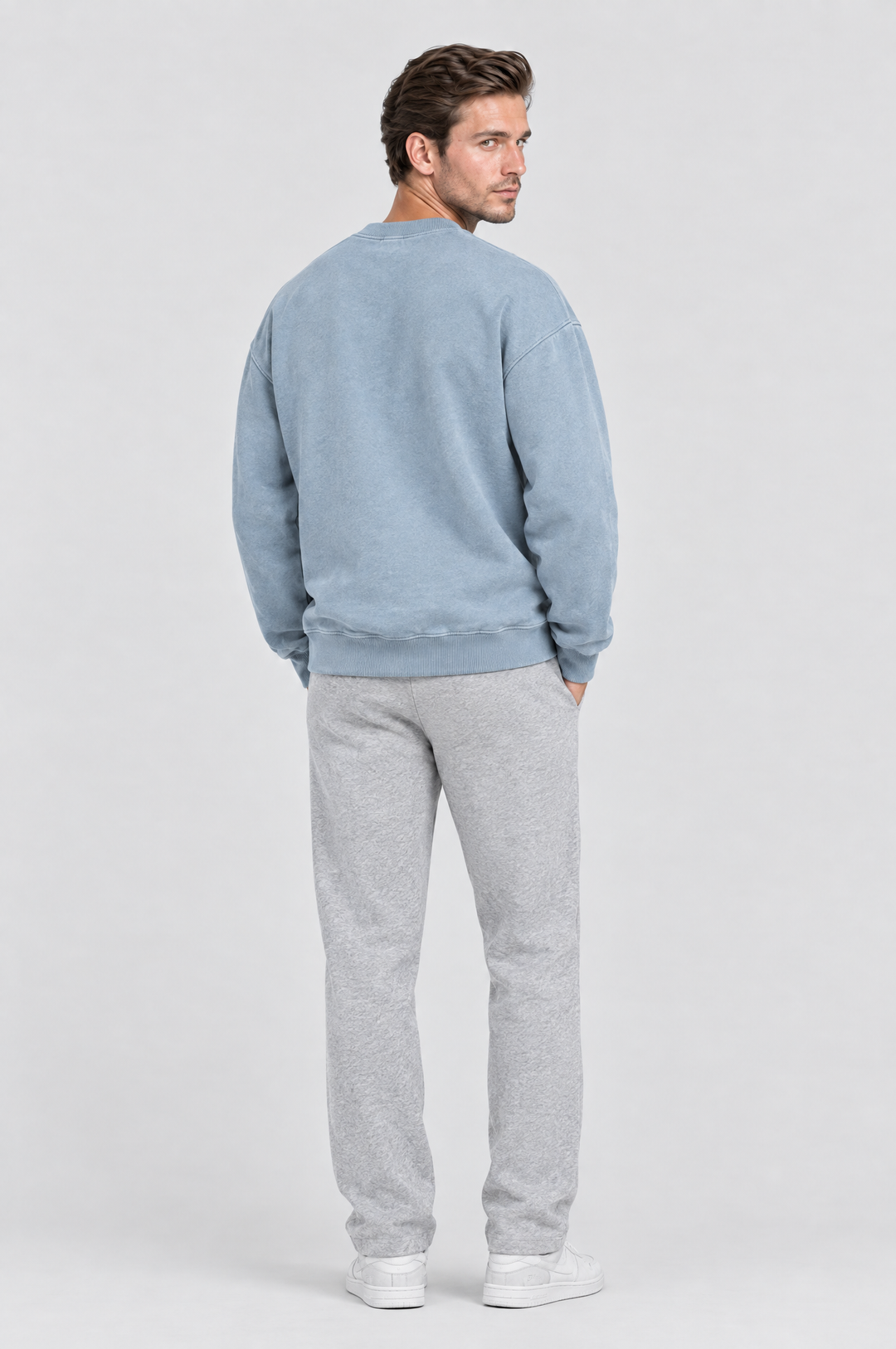 The Hackney Crewneck Sweatshirt in Dusty Blue, on model, back view