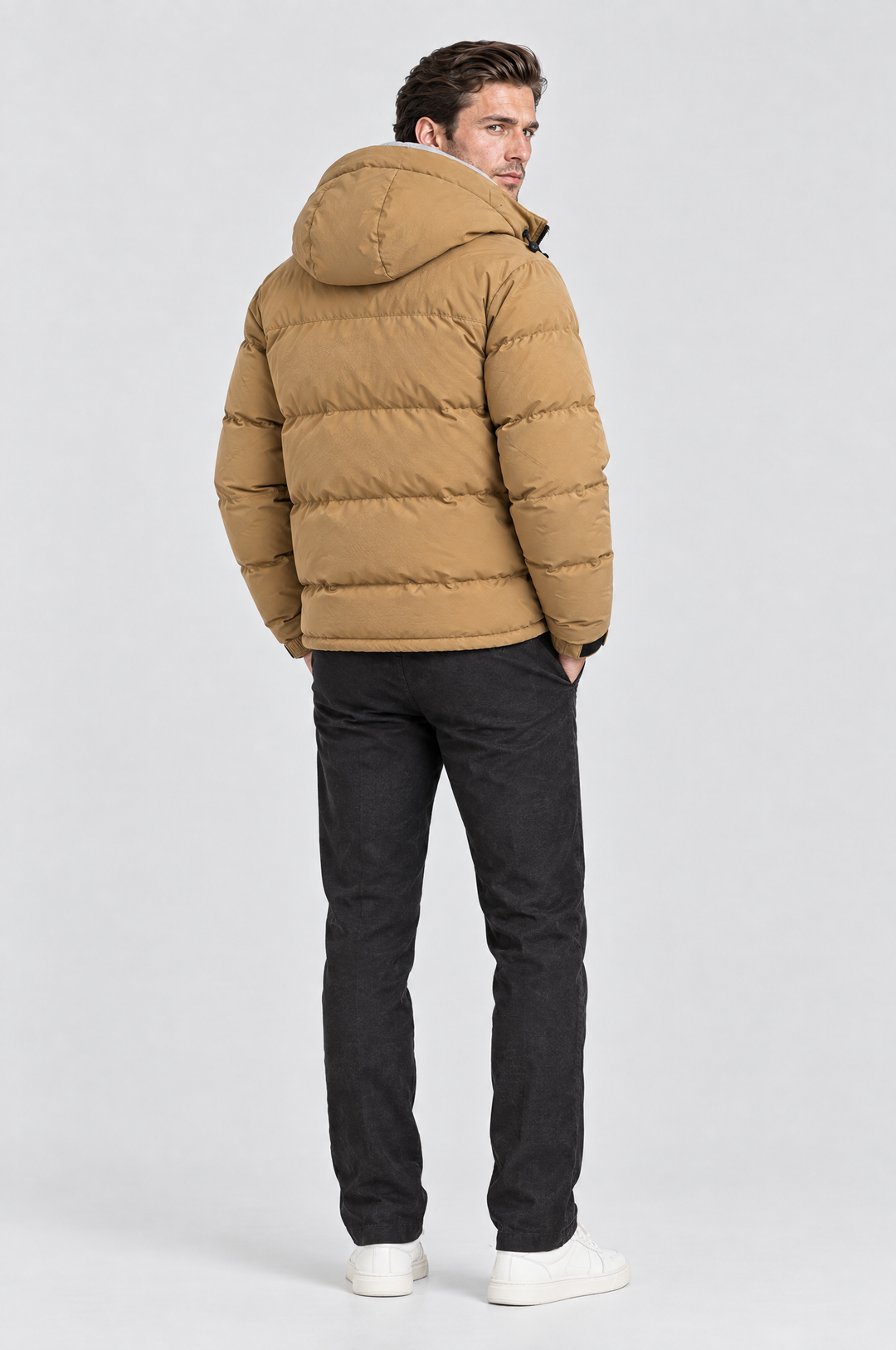 The Highgate Hooded Puffer in Tan, on model, back view