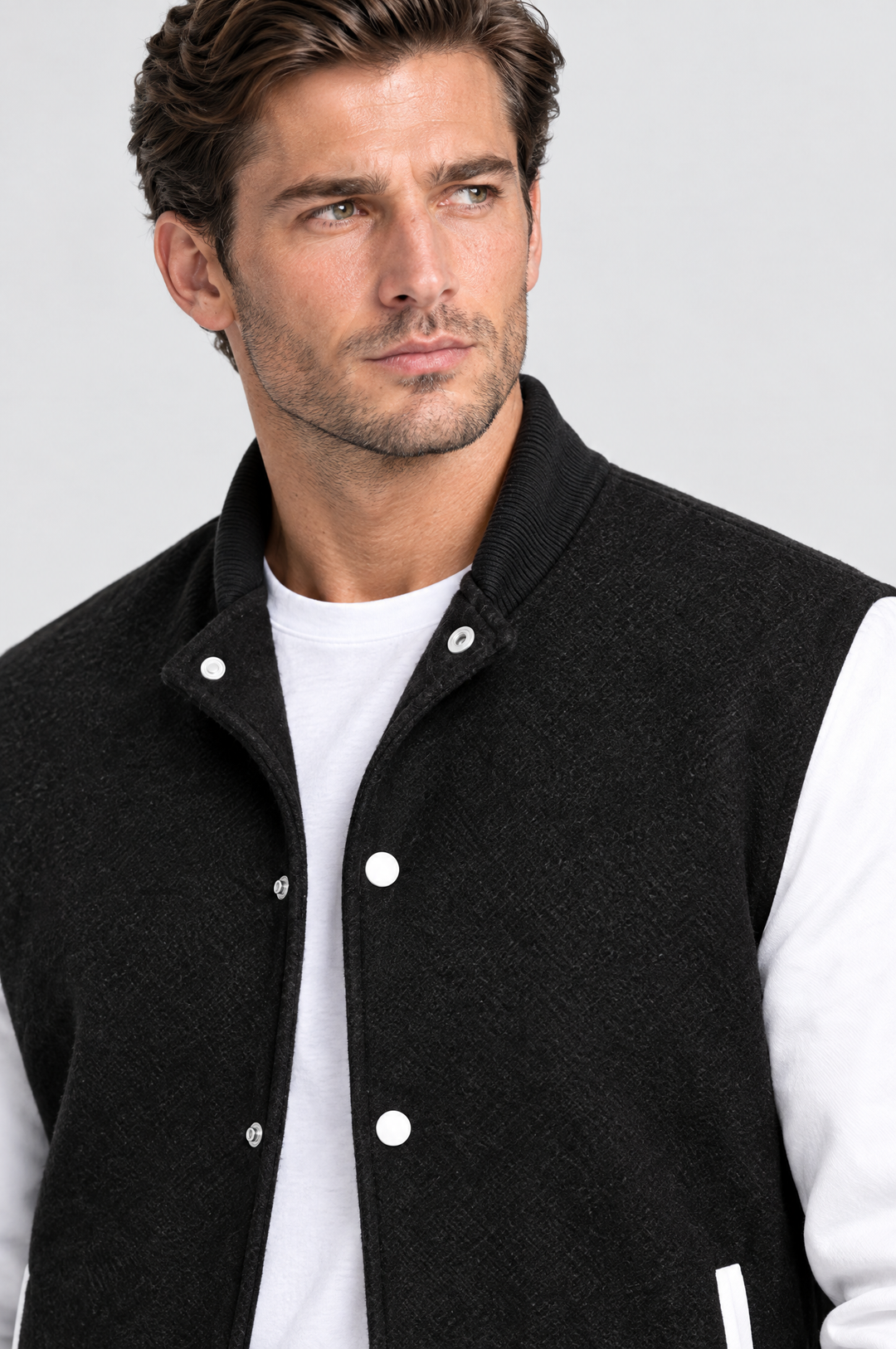 The Islington Varsity Jacket in Black, close-up detail