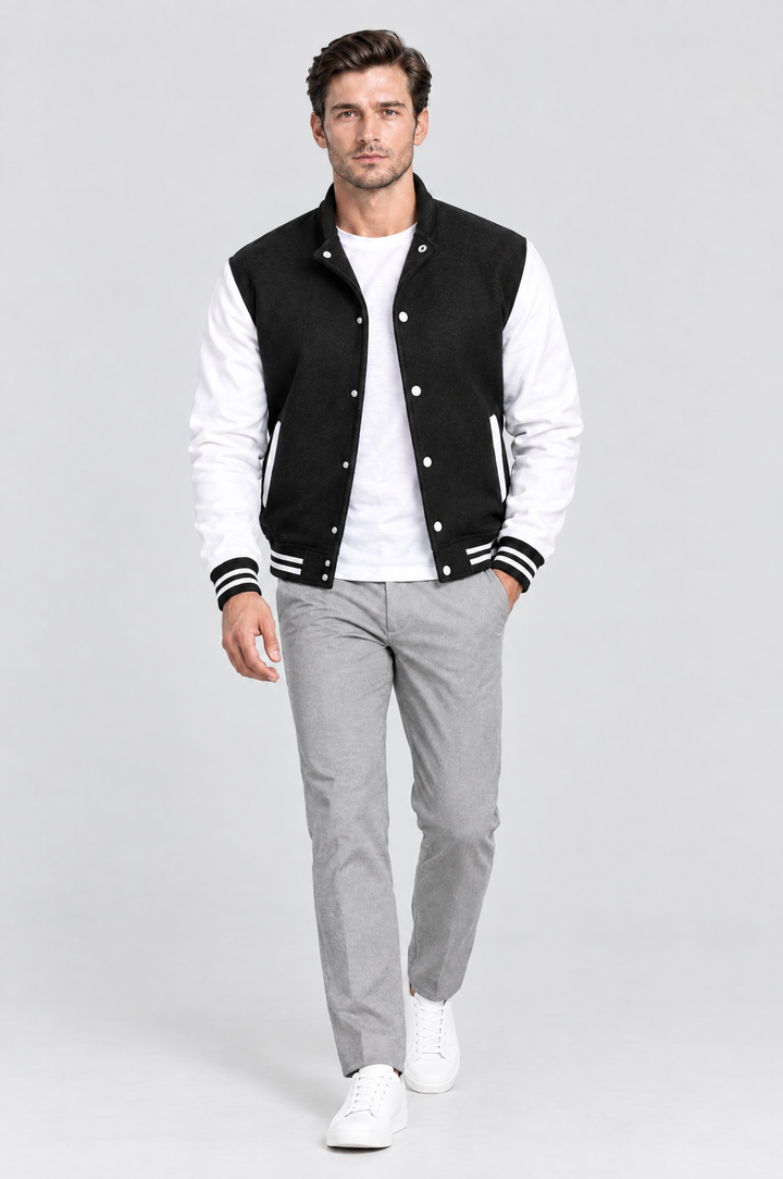 The Islington Varsity Jacket in Black, on model, full length