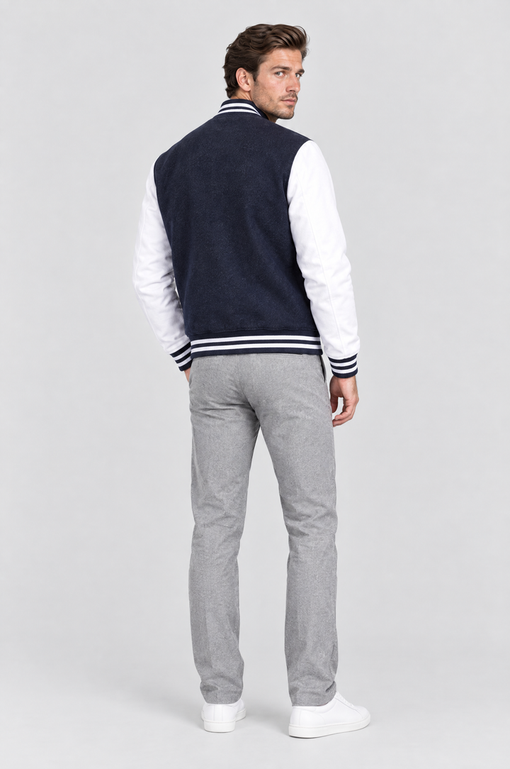 The Islington Varsity Jacket in Navy, on model, back view