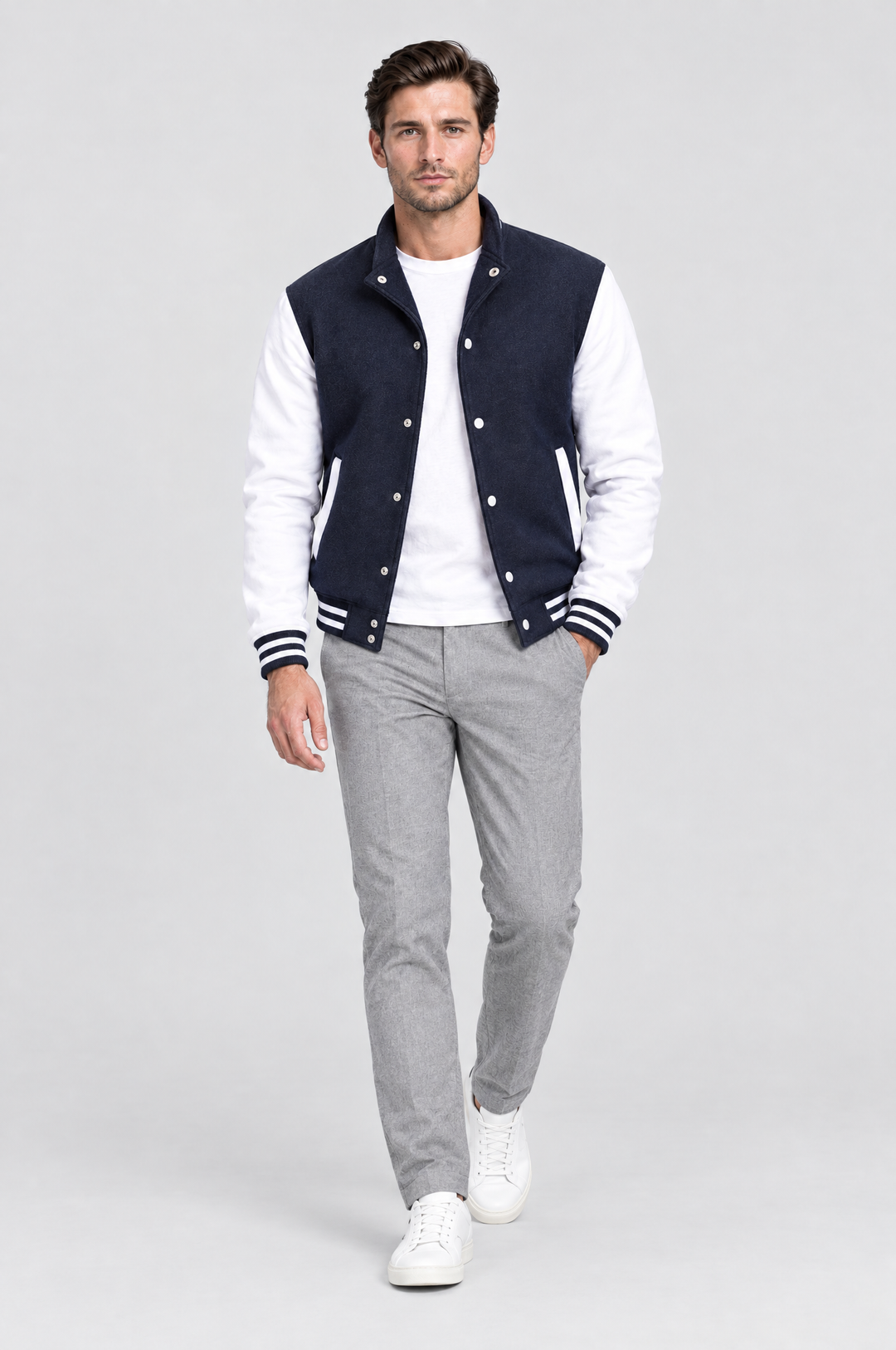 The Islington Varsity Jacket in Navy, on model, full length
