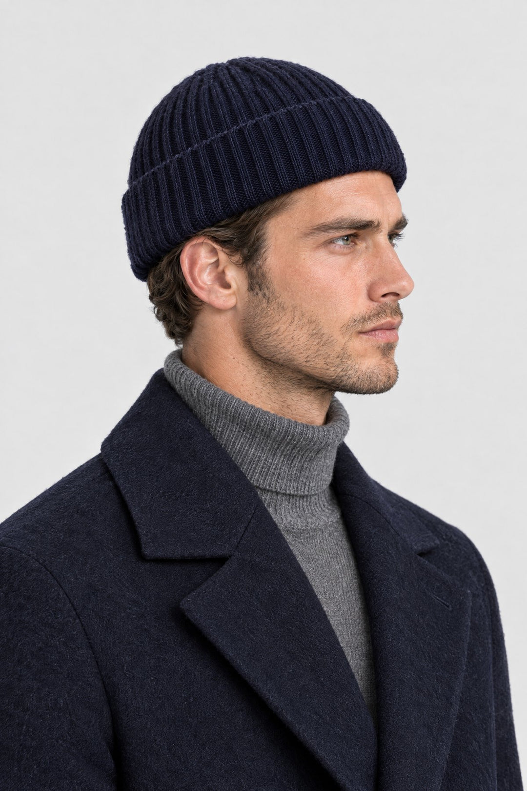 The Ribbed Beanie in Navy, side view
