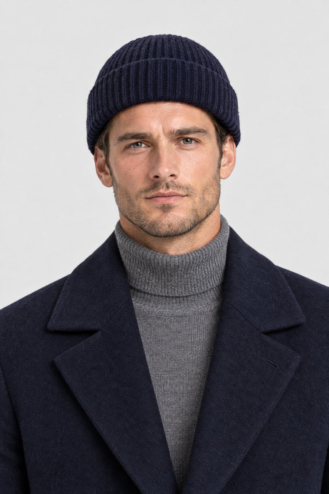 The Ribbed Beanie in Navy, on model