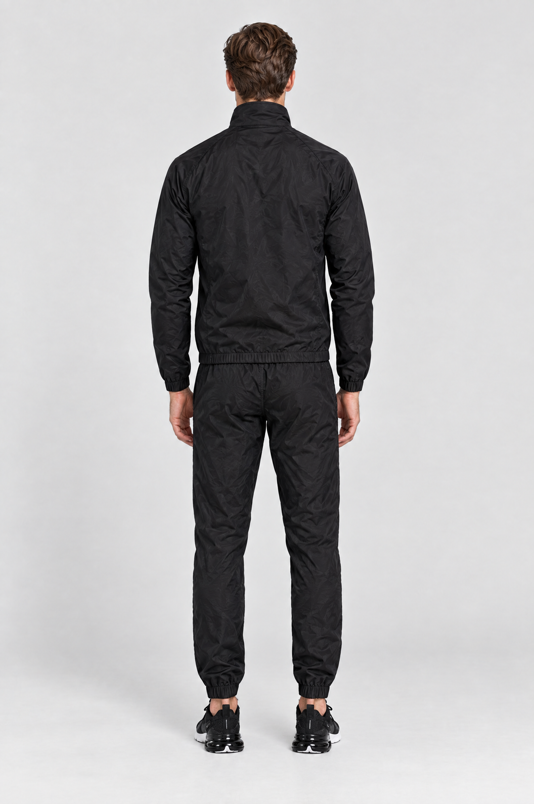 The Stratford Track Pant in Black, on model, back view