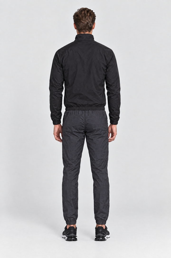 The Stratford Track Pant in Charcoal, on model, back view