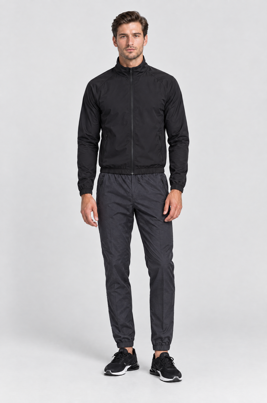 The Stratford Track Pant in Charcoal, on model, full length