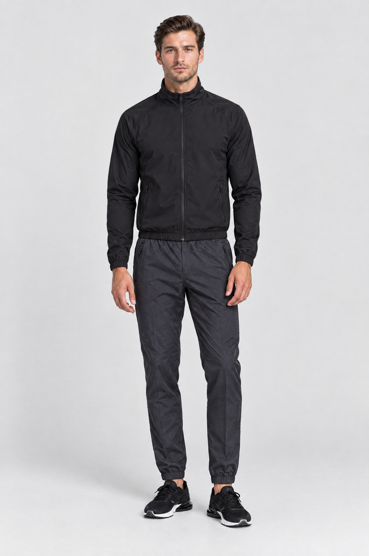 The Stratford Track Pant in Charcoal, on model, full length